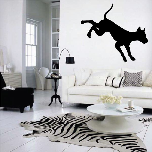 Kicking Doberman Pinscher wall decal, black dog silhouette mid-jump