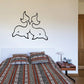 Kids twin dolphin wall decal with two dark outline dolphins above.