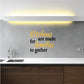 Kitchen wall decal: “Kitchens are made for families to gather”, “families” yellow script.