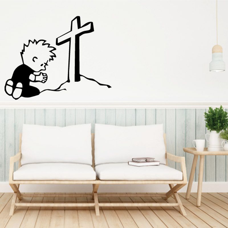 Kneeling praying decal with child kneeling beside a cross, black and white