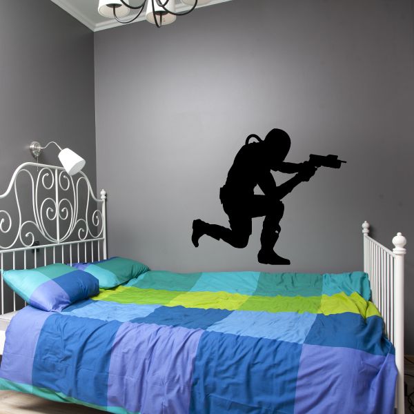 Black kneeling futuristic soldier wall decal with rifle silhouette
