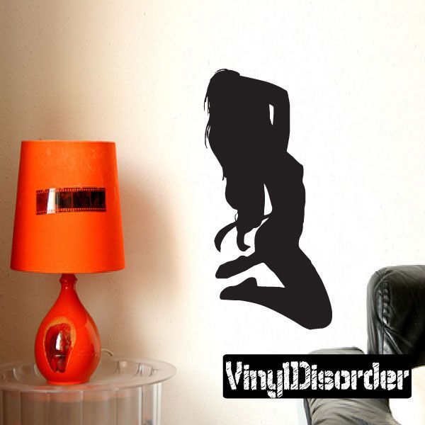 Kneeling stripper silhouette decal, black figure on wall with white logo text