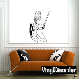 Kneeling shieldmaiden decal with sword, bare chest, and shield