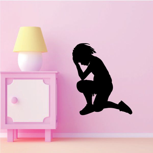 Praying kneeling silhouette decal with one hand on head, black figure
