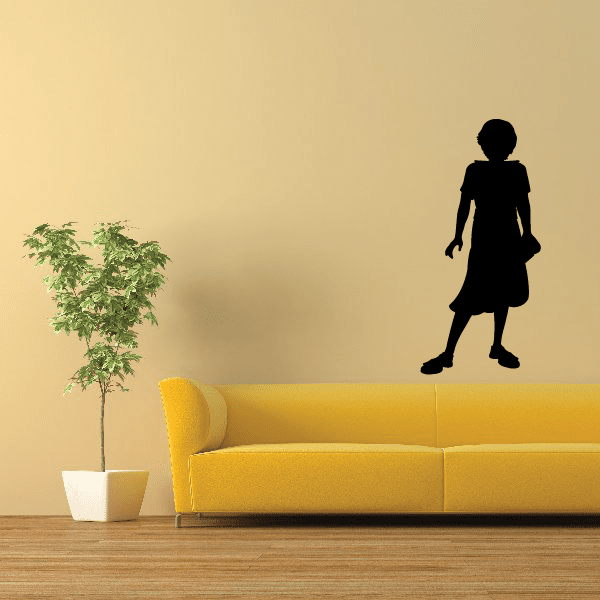 Black silhouette of a lady holding a bible wall decal