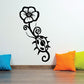 Ladybug crawling on flower wall decal, black outline with curled vine and bloom