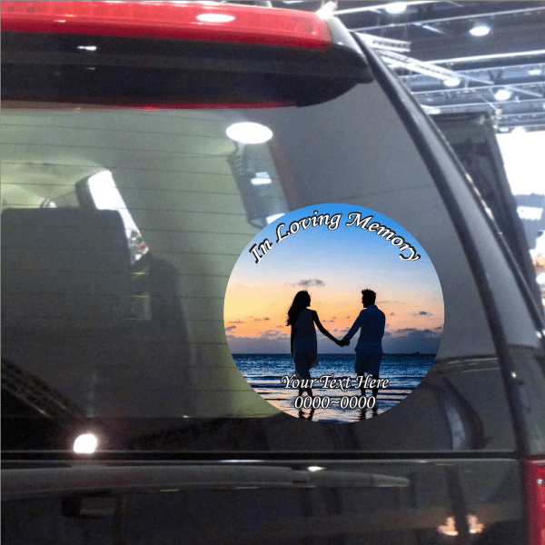 Circular remembrance car sticker with couple silhouettes at sunset and text 'Your Text Here'