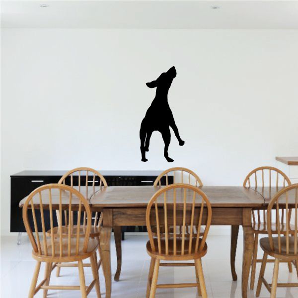 Black dog landing silhouette decal