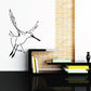 Shore bird wall decal, black silhouette with wings spread on light wall