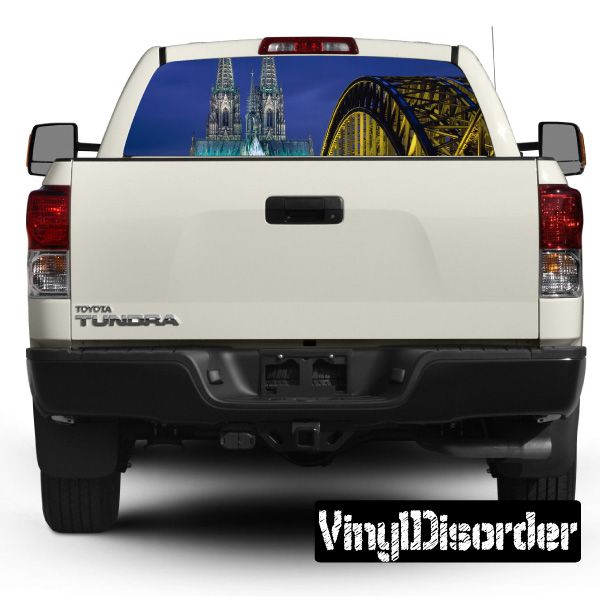 White pickup truck rear view with cathedral graphic on rear window