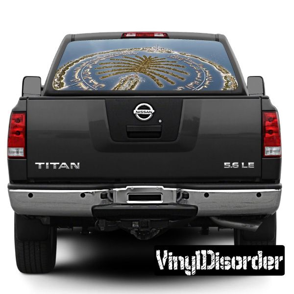Rear window decal graphic on black pickup truck rear, with Dubai landmark design
