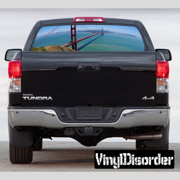 Rear window graphic decal with Golden Gate Bridge scene through dark panel