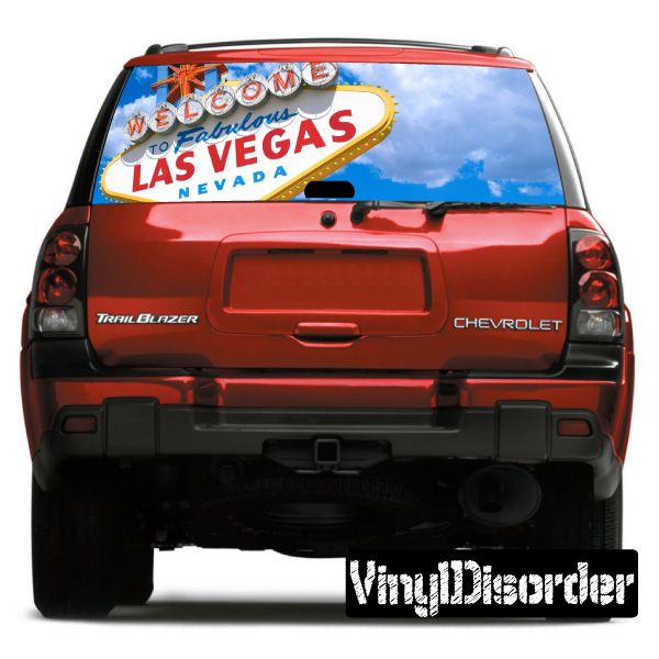 Rear window graphic on red SUV with Las Vegas Welcome sign and blue sky