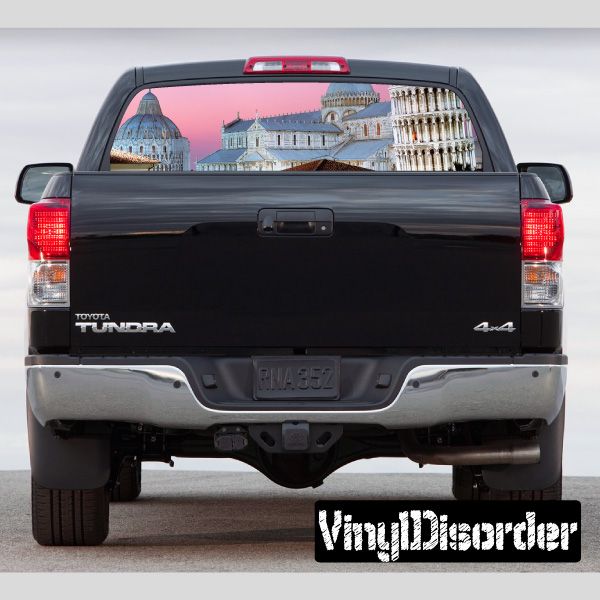 Pickup truck rear window graphic with Pisa landmarks over dark tailgate