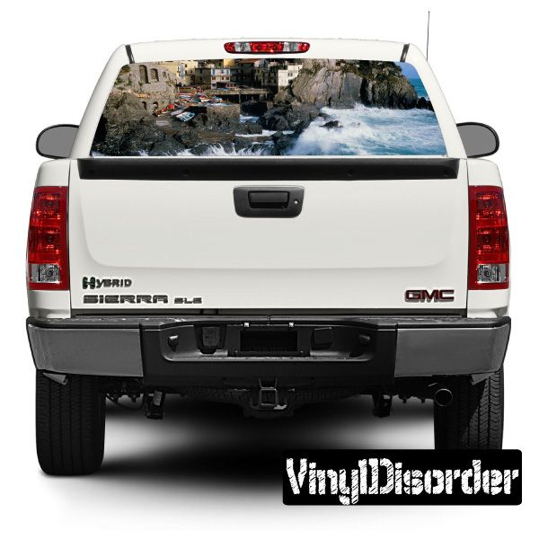 White pickup truck rear view, tailgate and bumper with large graphic decal