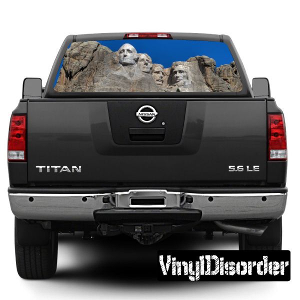 Black pickup truck rear window graphic with Mount Rushmore figures