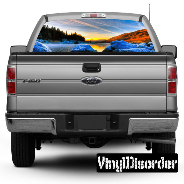 Rear window graphic on gray pickup truck, scenic landscape view through glass