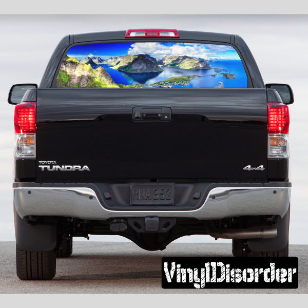 Rear window graphic decal with landscape view scene on vehicle back window