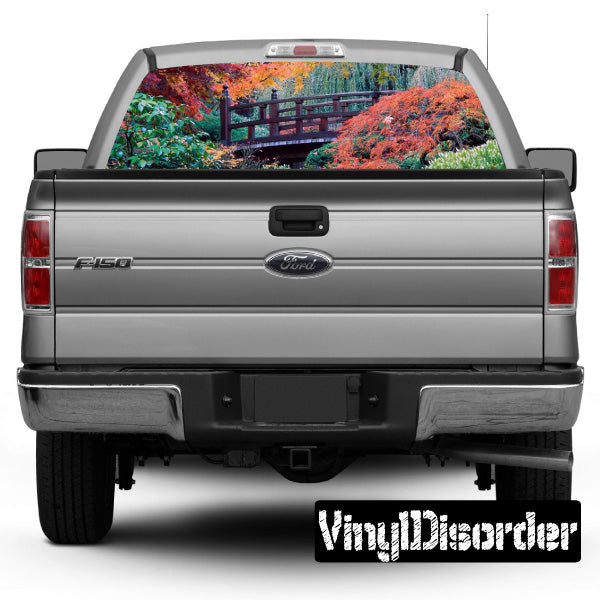 Vehicle rear window graphic with colorful autumn landscape scene