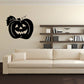 Black jack-o-lantern wall decal with smiling face and leaf accent