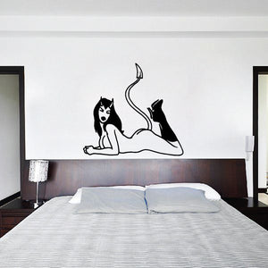 Devil girl decal: black silhouette lying down with raised tail and boots