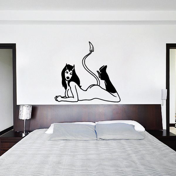 Devil girl decal: black silhouette lying down with raised tail and boots