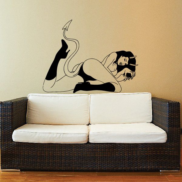 Black devil girl lying wall decal, leg and tail raised
