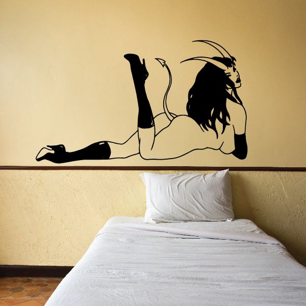 Devil girl wall decal, black silhouette of a lying girl with raised leg