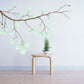 Leafy tree branch wall decal with light green leaves, die-cut printed design