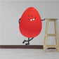 Red Easter egg character sticker with smiling face and stick arms, legs