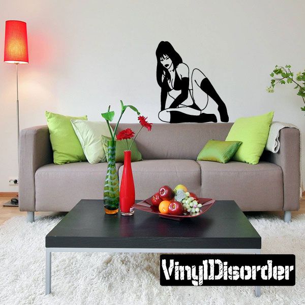 Pin-up style wall decal of leaning woman in black bikini and thigh-high stockings