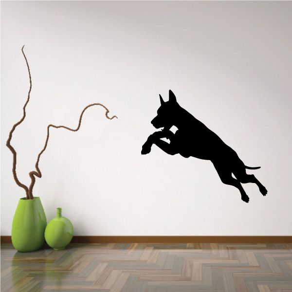 Leaping Doberman Pinscher wall decal, black silhouette in mid-jump
