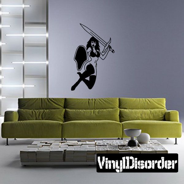 Leaping warrior woman wall decal with sword raised and shield by her side