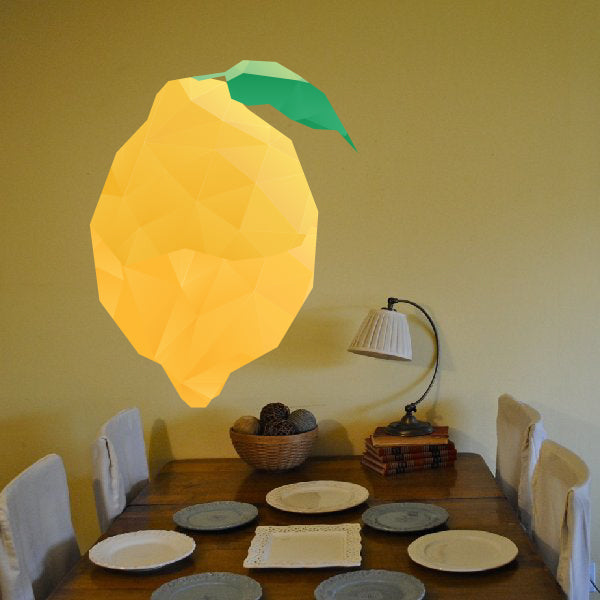 Polygon lemon wall sticker with green leaf, yellow geometric fruit shape