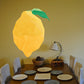 Polygon lemon wall sticker with green leaf, yellow geometric fruit shape