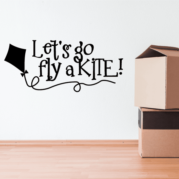 Kite wall decal with text “Let’s go fly a KITE!” and decorative arrow.
