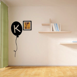 Letter K balloon decal: black round balloon with cream K letter and curly string