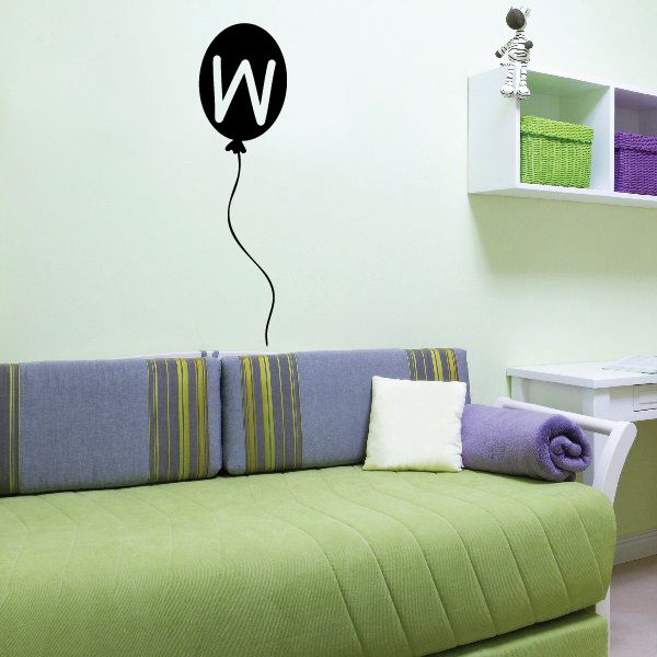 Black balloon decal with white letter W