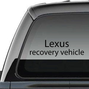 Vehicle decal with Lexus recovery vehicle text on car window