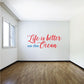 Ocean-themed wall decal with red cursive text and blue 'on the Ocean'
