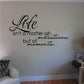 Wall quote decal with cursive 'Life' and 'isn't a matter of milestones, but moments'.