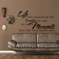 Inspirational wall decal with script quote: Life is not measured by breaths, by moments