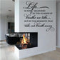 Wall decal with black cursive quote: life is not measured by breaths we take