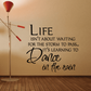 Black wall decal quote: "Life isn't about waiting... dance in the rain"