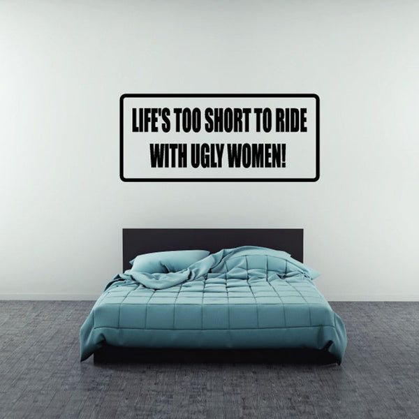 Rectangular wall decal with black border and bold text: “LIFE'S TOO SHORT TO RIDE”
