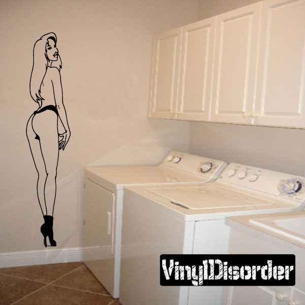 Wall decal featuring a black outline woman in heels and bare torso