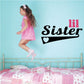 Wall decal with "Lil Sister" lettering and heart shape
