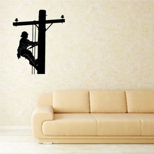 Black lineman descending a utility pole wall decal, silhouette with crossbar