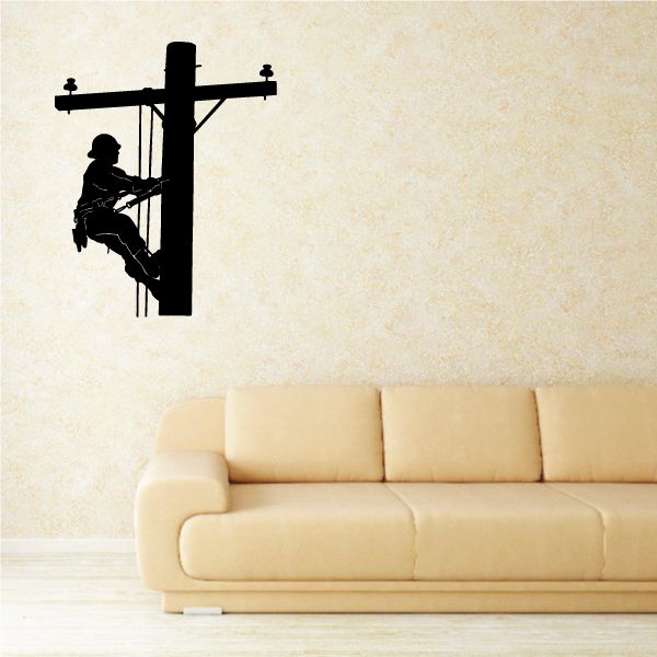 Black lineman descending a utility pole wall decal, silhouette with crossbar