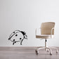 Black-and-white ladybug wall decal with dot pattern and small antennae